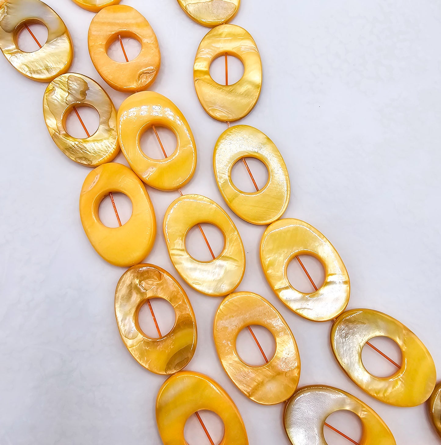 Orange AB Coated Mother of Pearl Oval Beads – Full 16" Strand