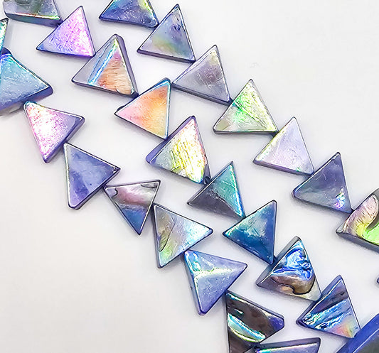 Iridescent triangle-shaped stones on a white background